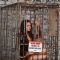 PETA behind the scenes with a caged Celina Jaitley