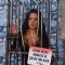 PETA behind the scenes with a caged Celina Jaitley