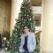 Shah Rukh Khan posing with a Christmas Tree in a Christmas Special photo shoot at Hotel Trident