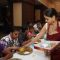 Sumona Chakravarti serving food at Maha Ashtami at North Bombay Sarbojanin Durga Puja