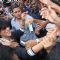 Fans crowd around Shahrukh Khan for an autograph,a hand shake or just a glimpse