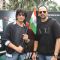 Shahrukh Khan and Rohit Shetty hold the Tri-color at Big Cinemas