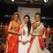 Esha Kopikar and Sonali Bendre showcase a creation of talent box at LAKME FASHION WEEK 2013