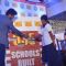 Arjun Kapoor helps the children solve a puzzle at a P&G Shiksha event