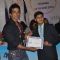 Sonu Sood giving certificate to student at  MUNA event .