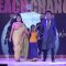 Guests with a child walk the ramp at the Teach for Change 2014 Fashion Show