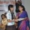 Naina Kanodia awards a student at the NDTV Save The Tigers Contest