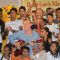 Brett Lee poses with a guitar and with the kids at Mewsic India Foundation