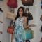 Shazahn Padamsee poses with a hand bag at the Launch of Madame's Studio Collection
