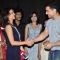 A guest greets Aamir Khan at the Premiere of Makrand Deshpande's Saturday Sunday