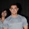 Aamir Khan gives a smiling pose for the camera at the Premiere of Saturday Sunday