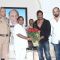 R R Patil felicitates Ajay Devgn with a bouquet of Flowers