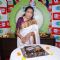 Asha Bhosle cuts a cake at 92.7 Big FM Studio