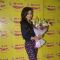 Soha Ali Khan poses with flower boquet at Radio Mirchi Studio