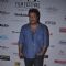Tigmanshu Dhulia poses for the media at the 16th MAMI Film Festival Day 3