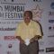 Saurabh Shukla poses for the media at the Closing Ceremony of 16th MAMI Film Festival
