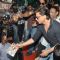 Shahrukh Khan distributes the Happy New Year DVDs among his Fans at the theatre
