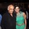 Mukesh Bhatt poses with a guest at the Launch of Rajneeti 2
