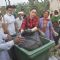 Tammanah unloads the garbage in a bin at a Cleanliness Drive
