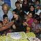 Children feed cake to Aishwarya Rai Bachchan at Smile Train Organisation