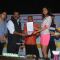 Manasvi Mamgai giving an award to a member at Chita Jeet Kune Do Global Sports Acadamy