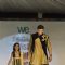 Sangram Singh walks the ramp with a small girl at Wellingkar's 26/11 Tribute