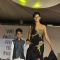 Shakti Mohan walks the ramp with a small boy at Wellingkar's 26/11 Tribute