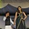 Lisa Ray walks the ramp with a small boy at Wellingkar's 26/11 Tribute