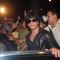 Shah Rukh Khan smiles for the camera at Airport