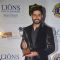 Abhishek Bachchan poses with her award at Lion Gold Awards