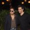 Mika Singh and Punit Malhotra pose for the media at Farah Khan's Birthday Bash