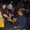 Aishwarya Rai Bachchan was snapped greeting Rajinikanth at the Music Launch of Shamitabh