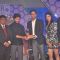 Riteish Deshmukh receives an award at CSR Awards