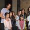 Arjun Rampal poses with children at the Special Screening of Roy