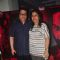 Ramesh Taurani poses with wife at the Special Screening of Badlapur