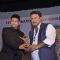 Tigmanshu Dhulia receives an award at the IFFP 2015 Award Ceremony