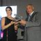 Sunny Leone receives an award at Indian Racing Excellence Awards