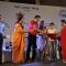 Anu Malik presents an award to a girl at IMC Ladies Wing Event