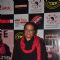 Anup Jalota poses for the media at a Musical Event