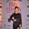 Kanika Kapoor poses for the media at Femina Miss India Finals Red Carpet