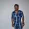 Ajay Devgn poses for the media at the Promotions of Drishyam on Fever FM