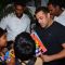 Salman Khan Snapped Distributing books to street Kids Outside Olive