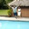 Akshay Kumar jumping in a swimming pool