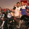 Motogp world champion Valentino Rossi and Bollywood actor John Abraham at a press meet in New Delhi on Sunday