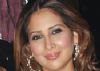 Kim Sharma strikes a pose during the shooting of an item song