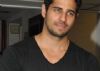 Why doesn't Sidharth want to fit into his clothes?