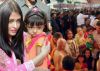 Aishwarya Rai Bachchan tries to shield her daughter from the mob